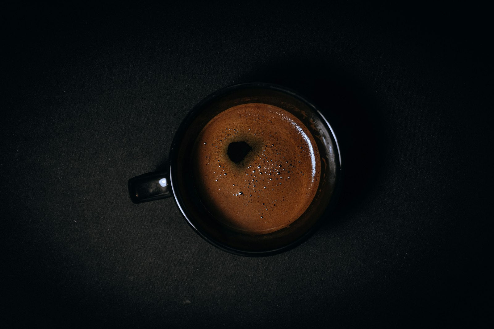 Espresso cup on a dark table
